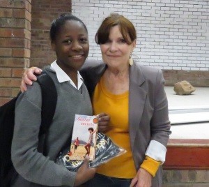 Jayne gave a signed copy of her Harmony High title, Soccer Secrets, to Violet Kaluwa, who liked the fact that Lunga, the main character, is small but fast.